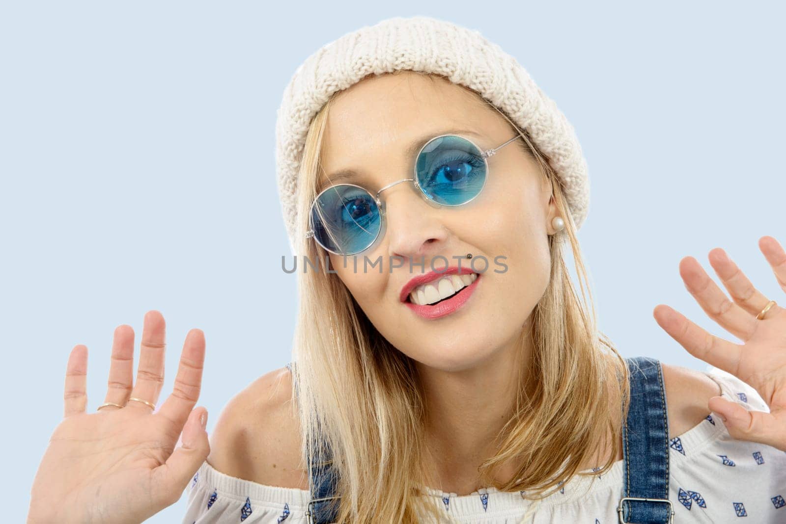 Portrait of a beautiful blond middle-aged woman with sunglasses