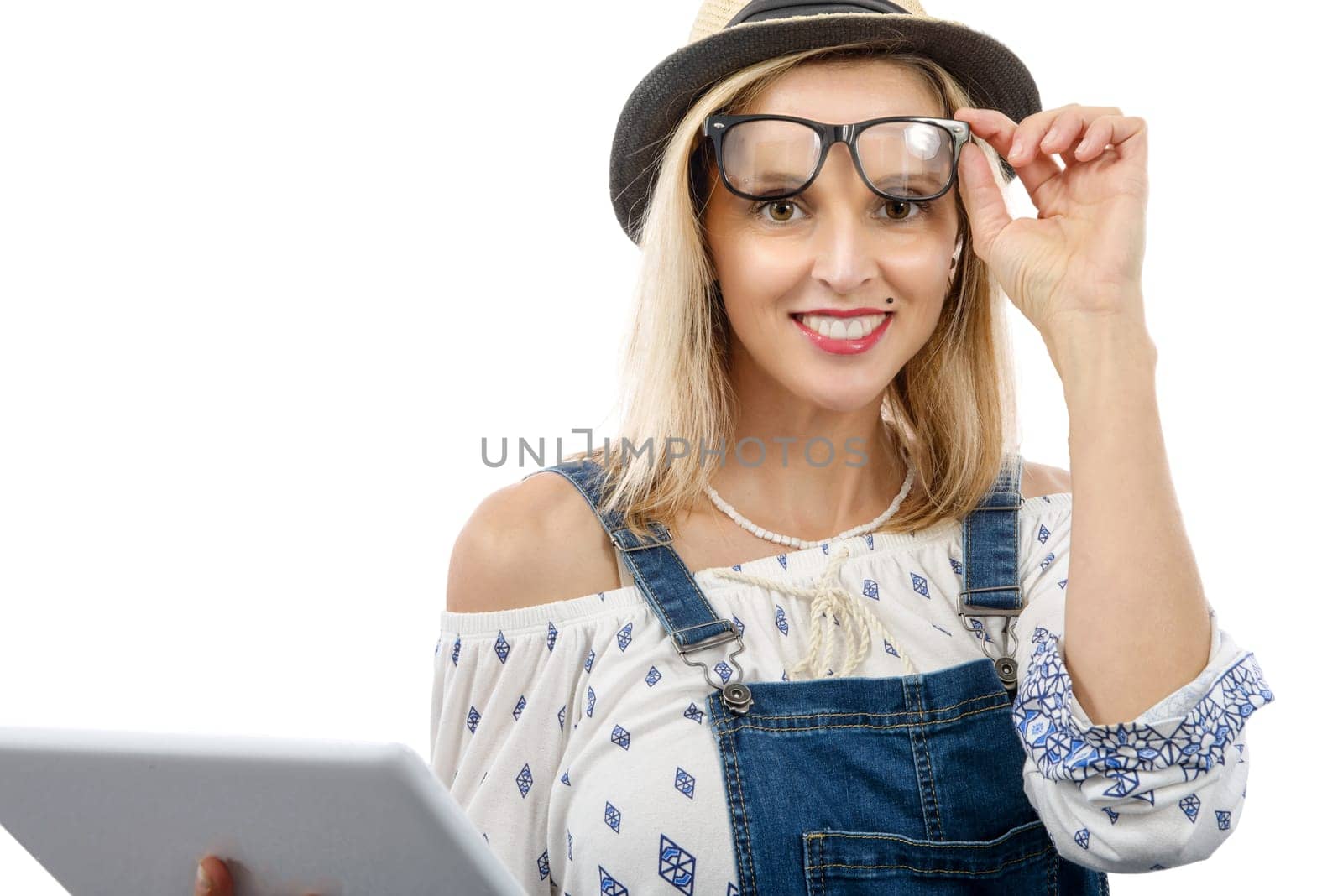 beautiful blond middle-aged woman with tablet