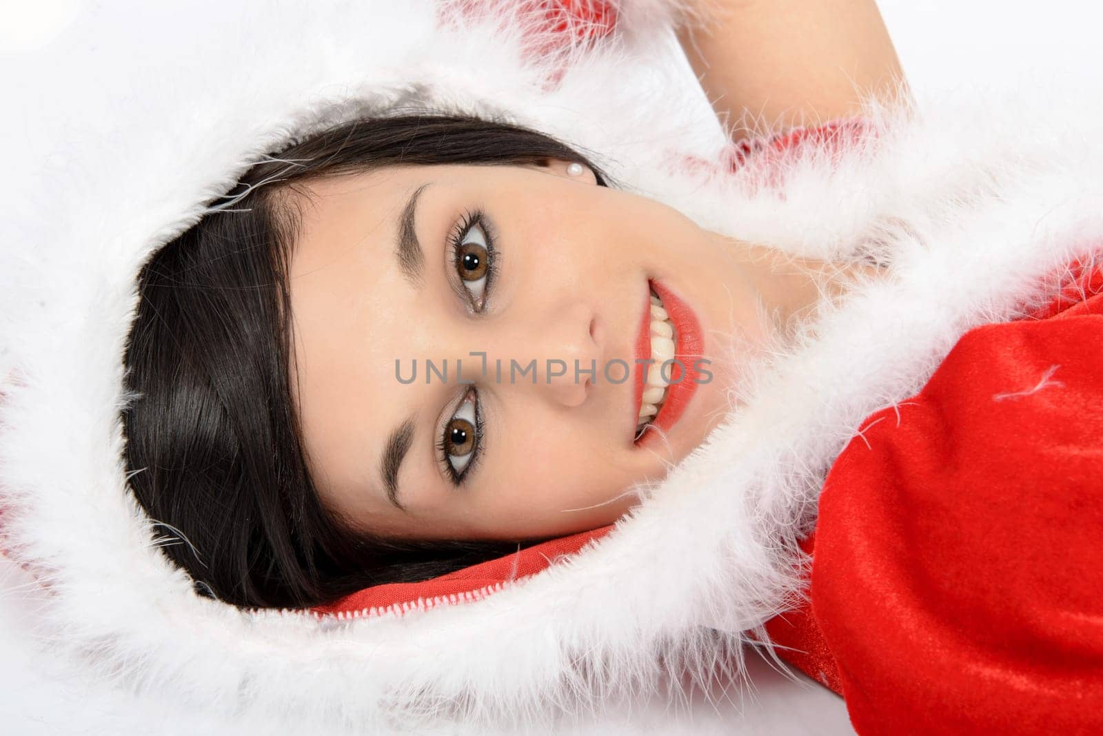portrait of beautiful  girl wearing santa claus clothes