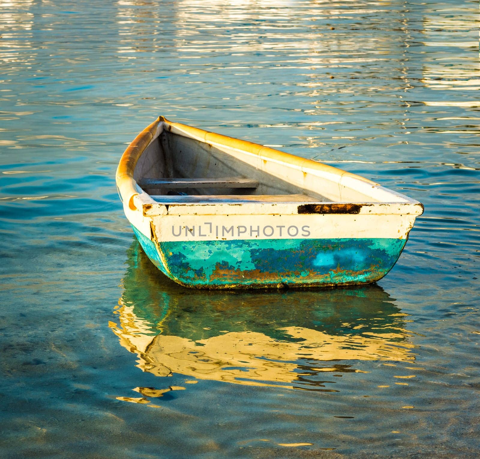 Old fishing boat at sunset. Mauritius
