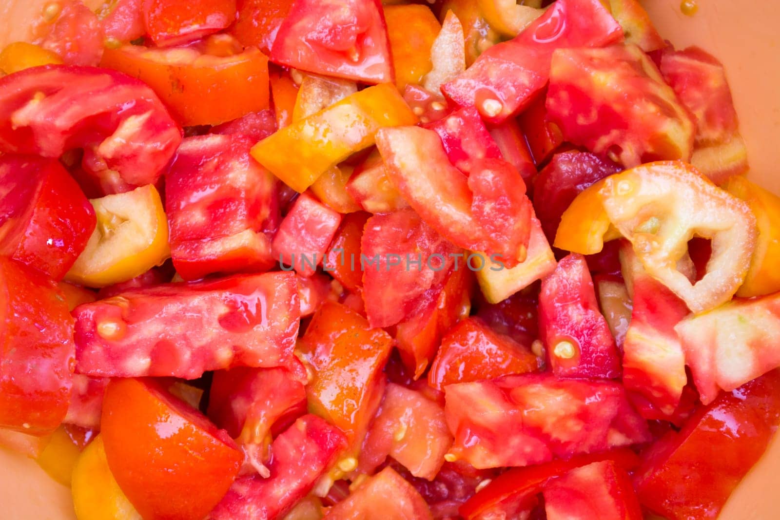 Chopped red tomato in a bowl. Ready for salad