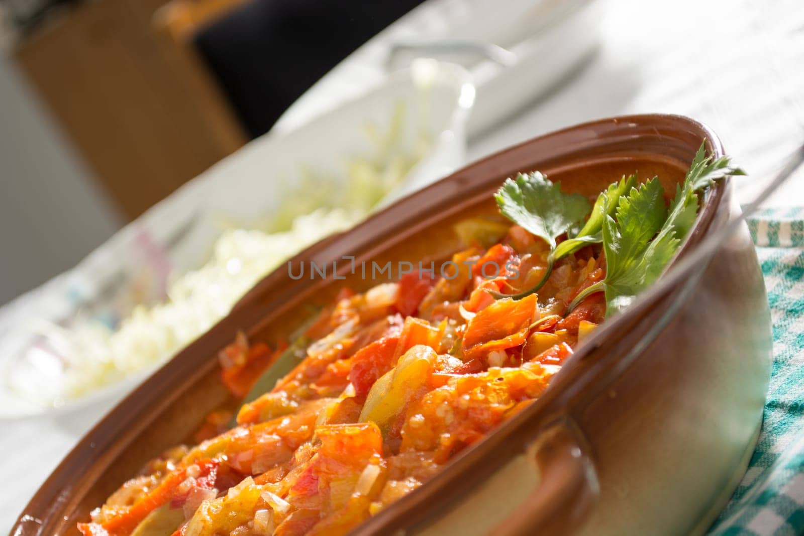 Closeup of delicious stew with mixed vegetables, arranged with green and purple leaves