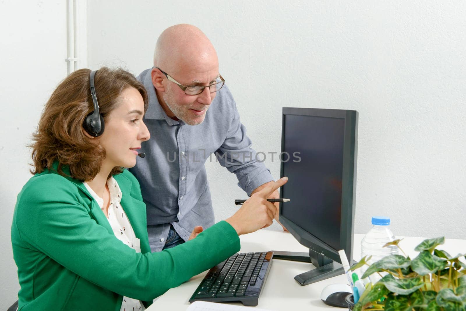 beautiful young secretary and his boss in the office
