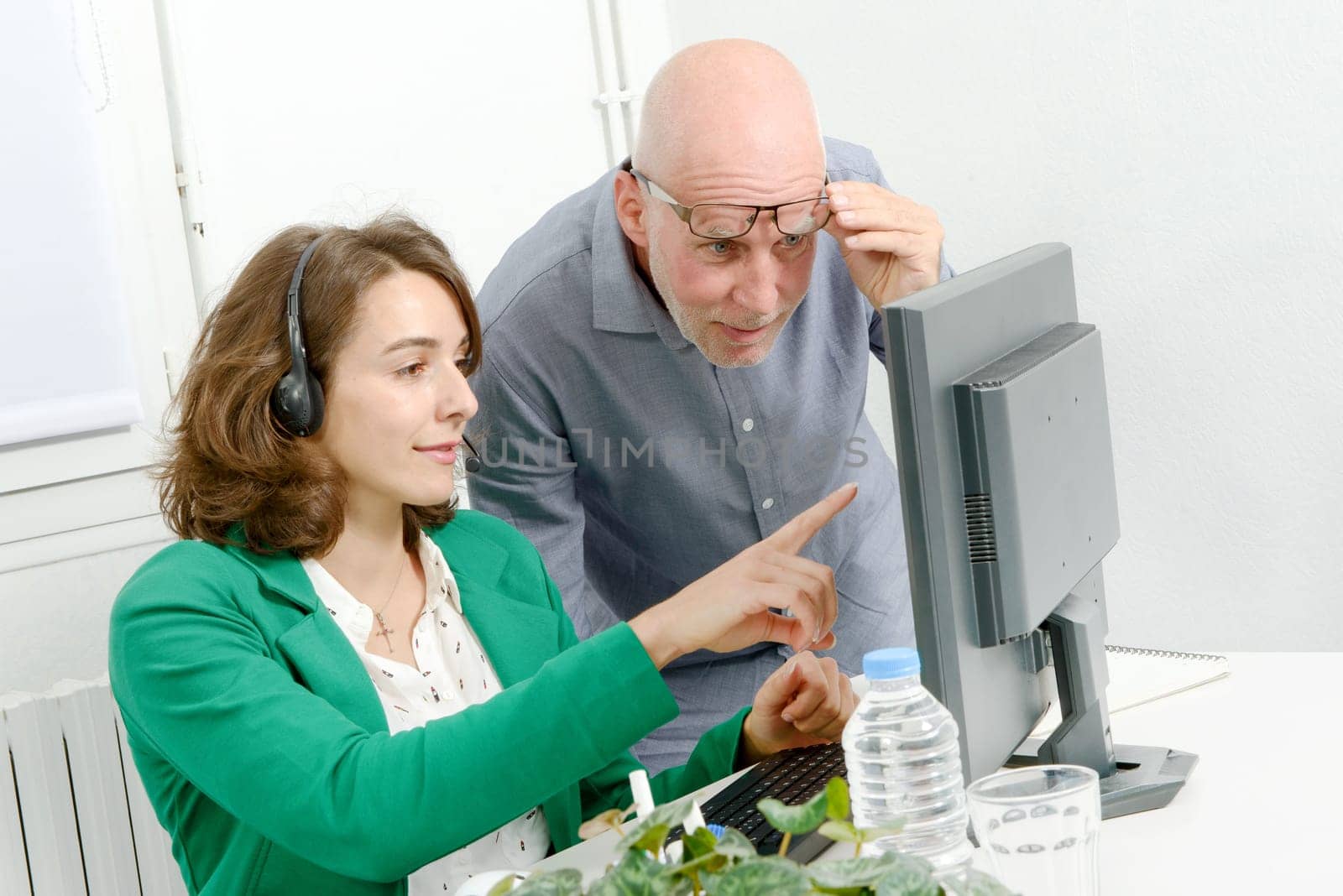 beautiful young secretary and his boss in the office