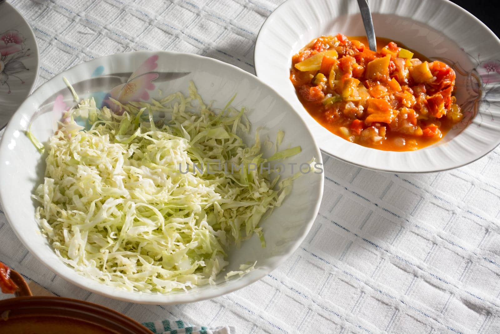 Stewed vegetables on a table with salad