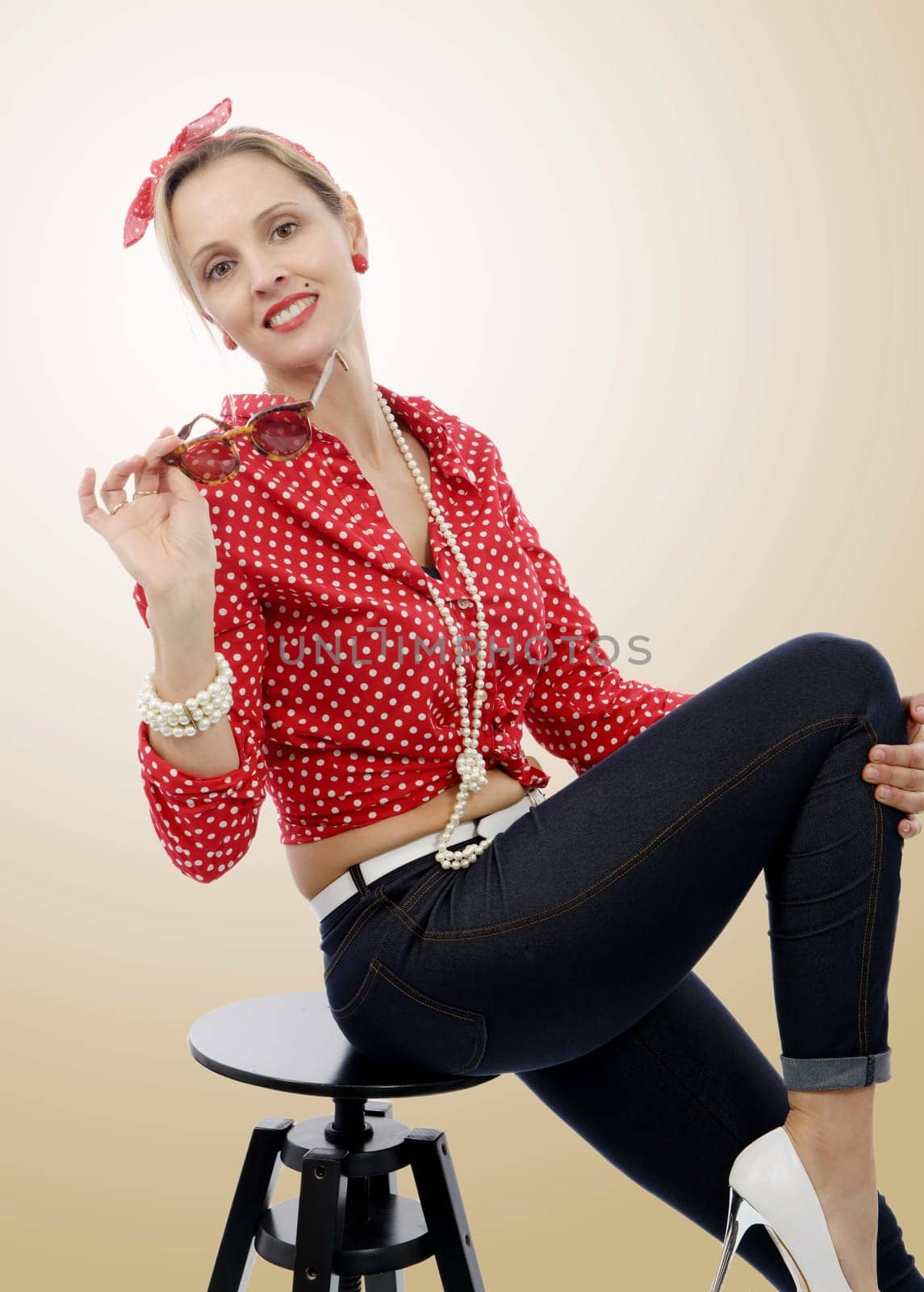 beautiful blond smiling woman in retro style