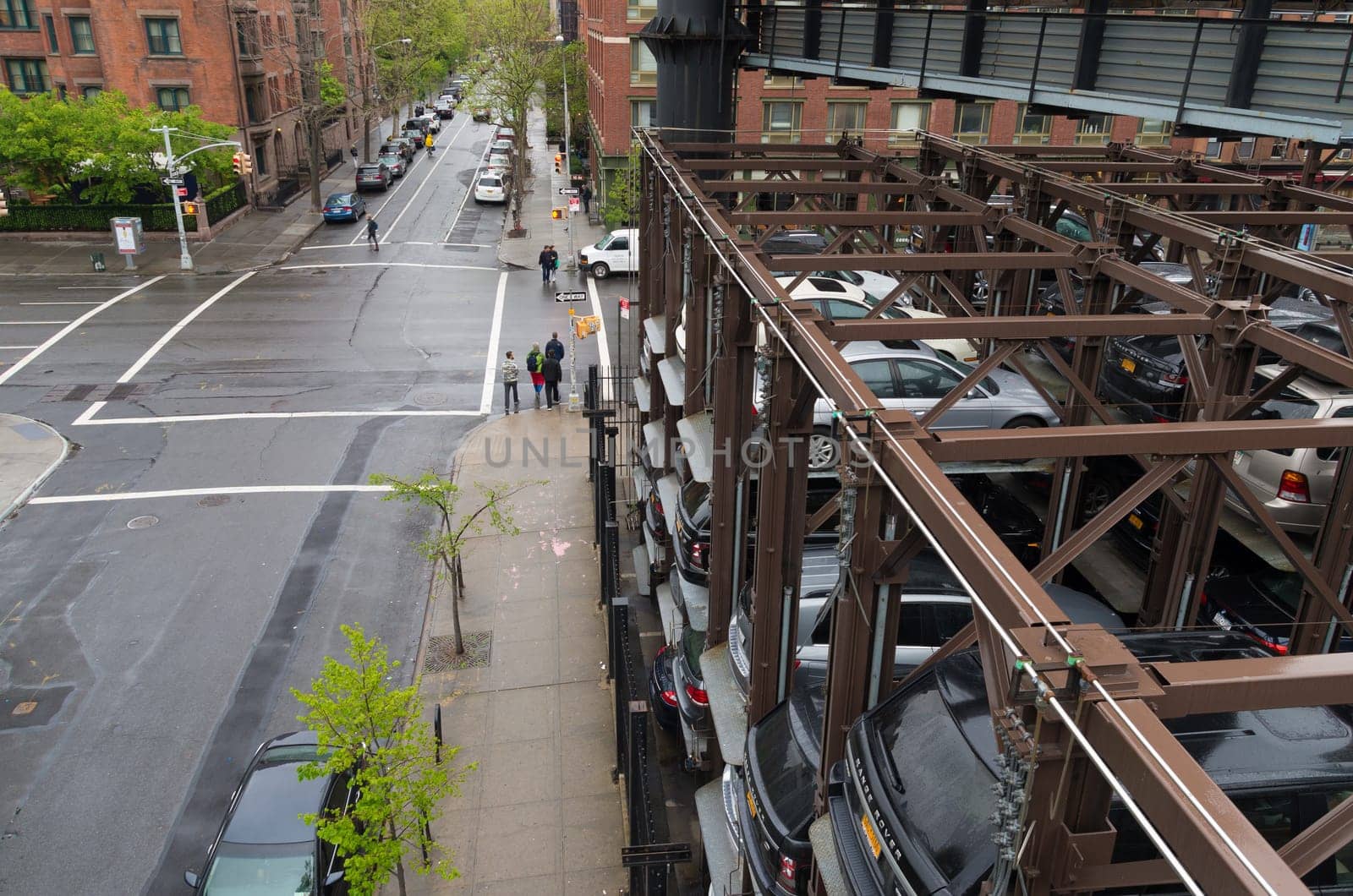 NEW YORK CITY - MAY 1, 2016: Due to lack of space cars are parked on elevated parking places in Chelsea, a neighbourhood in Manhattan