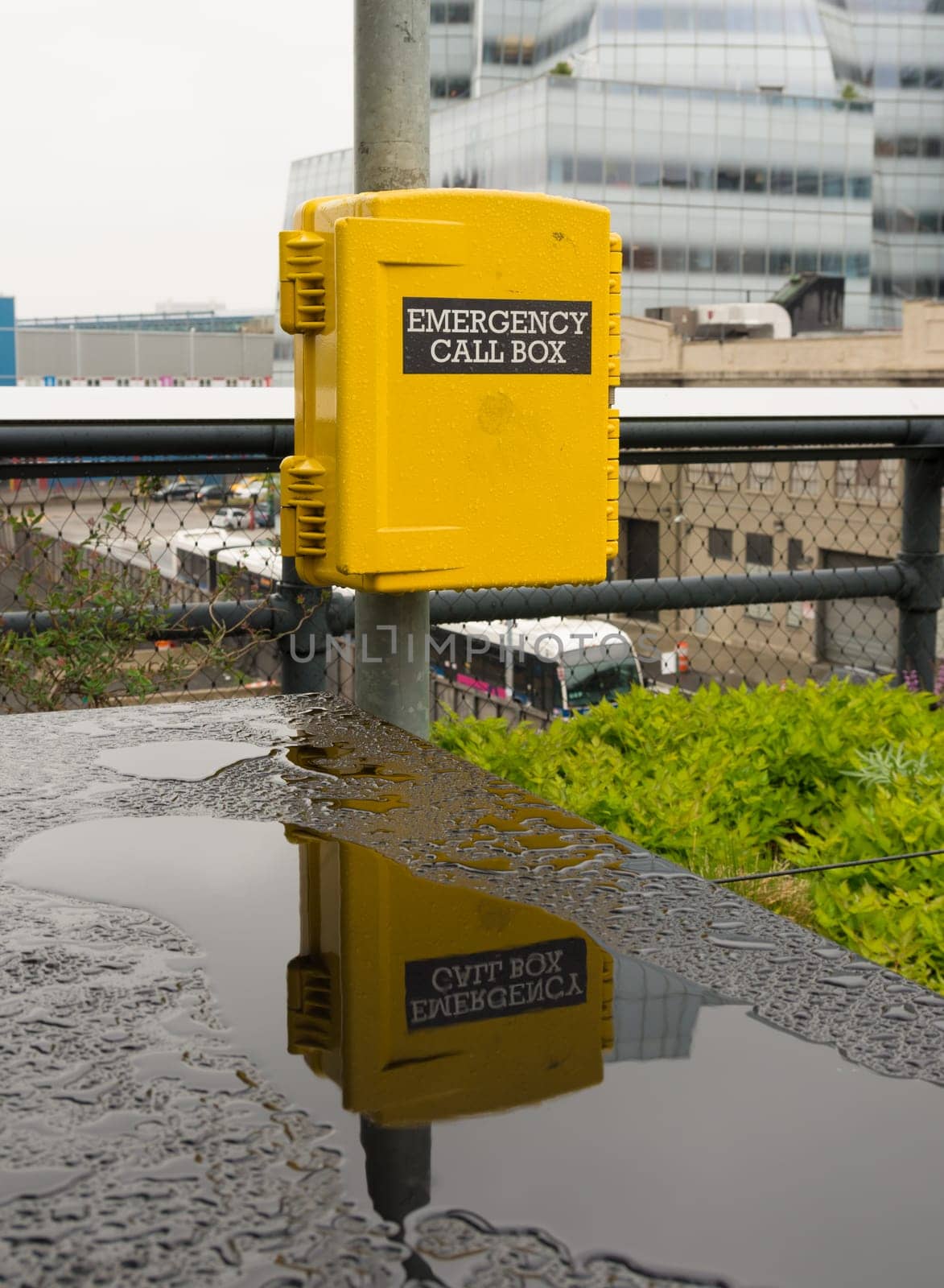 yellow emergency call box in New York for assistance in case of an emergency