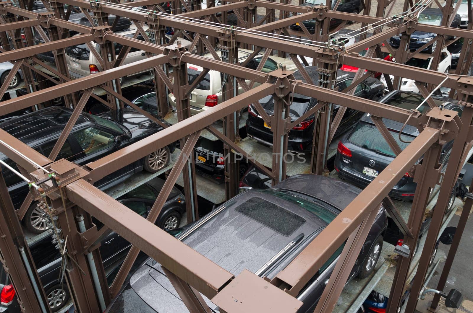 NEW YORK CITY - MAY 1, 2016: Due to lack of space cars are parked on elevated parking places in Chelsea, a neighbourhood in Manhattan