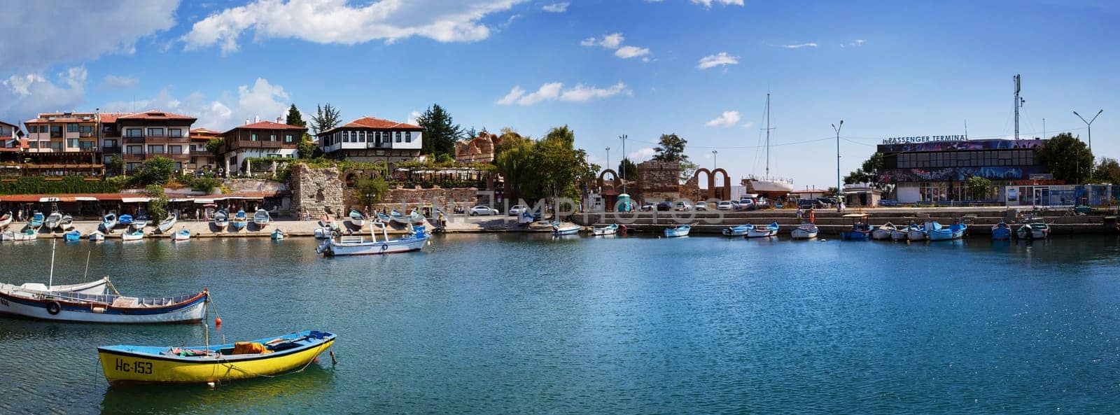 Nesebar, Bulgaria, September 06, 2013: Fishing boats in the harbor of the old town of Nessebar, Bulgaria. Old Nesebar is an ancient town on the Bulgarian Black Sea coast. Panoramic shot.