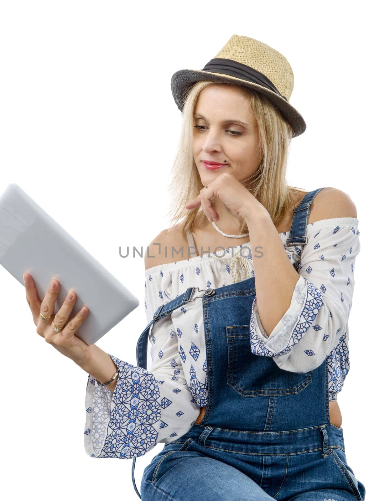beautiful blond middle-aged woman with tablet computer