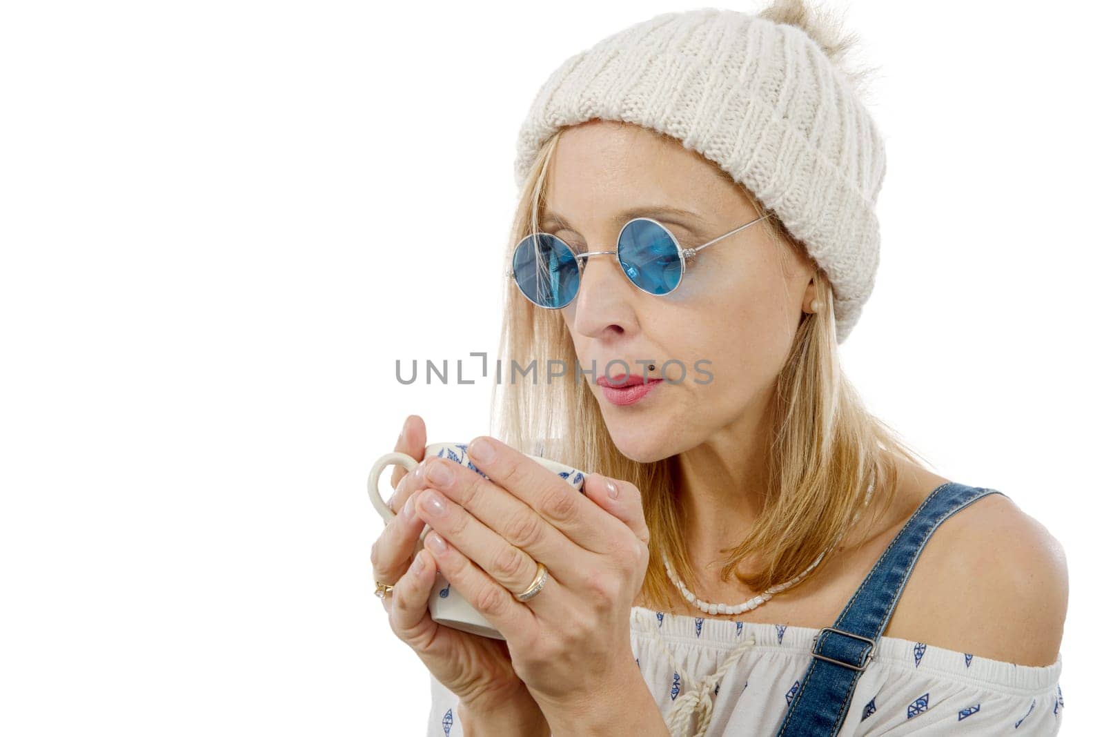 pretty blond woman drink a cup of tea