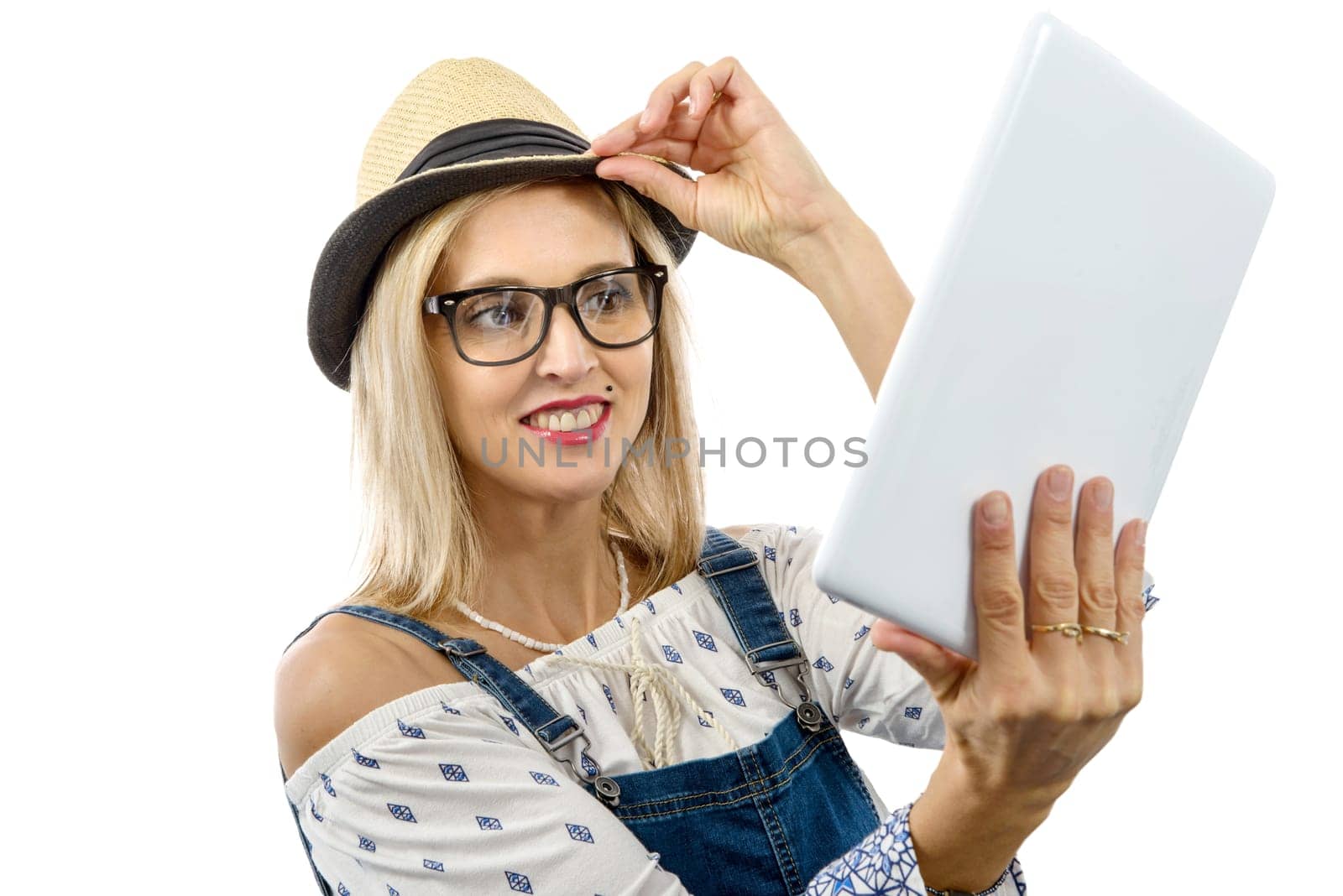 beautiful blond middle-aged woman with tablet computer