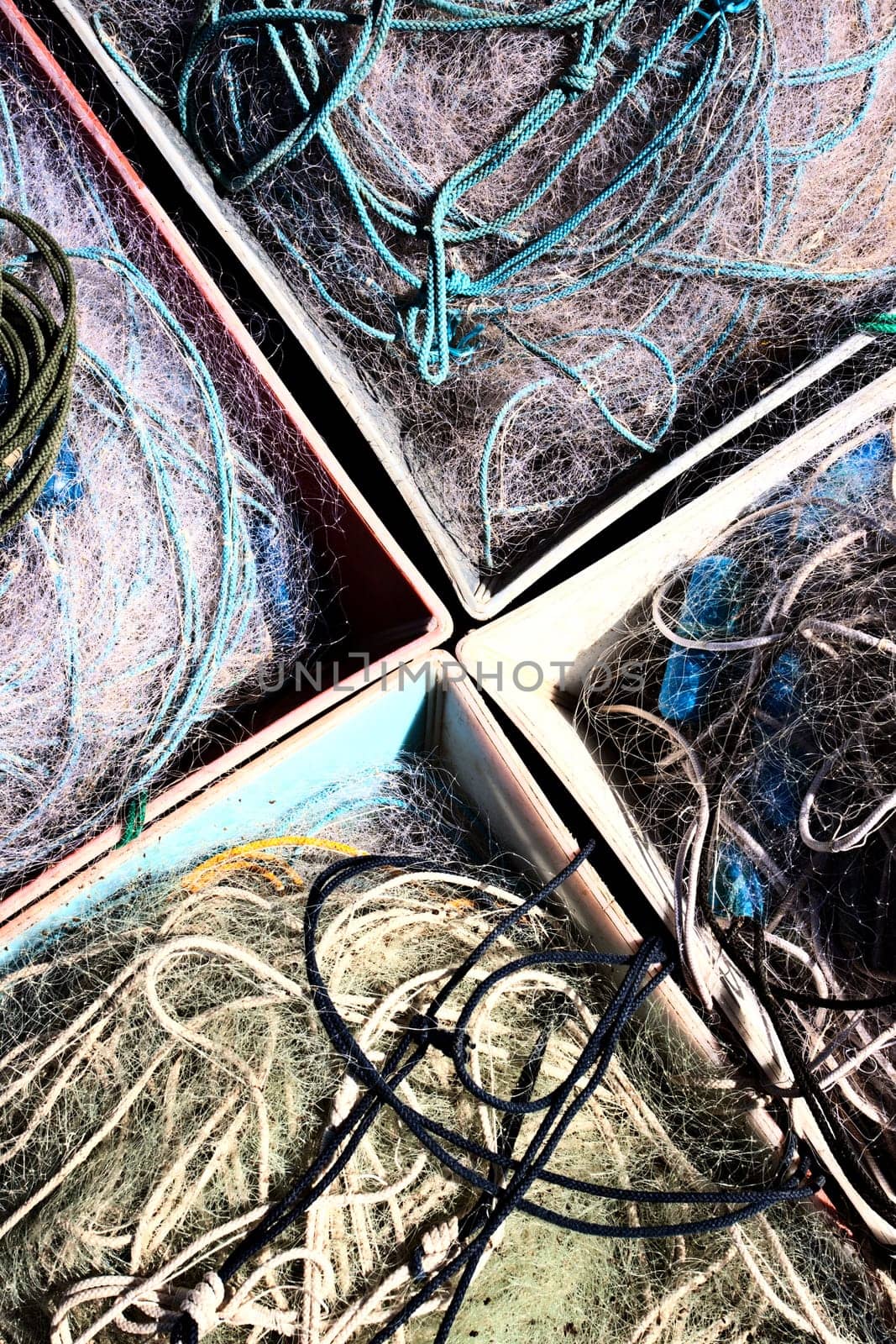 Old fishing nets in container on dock