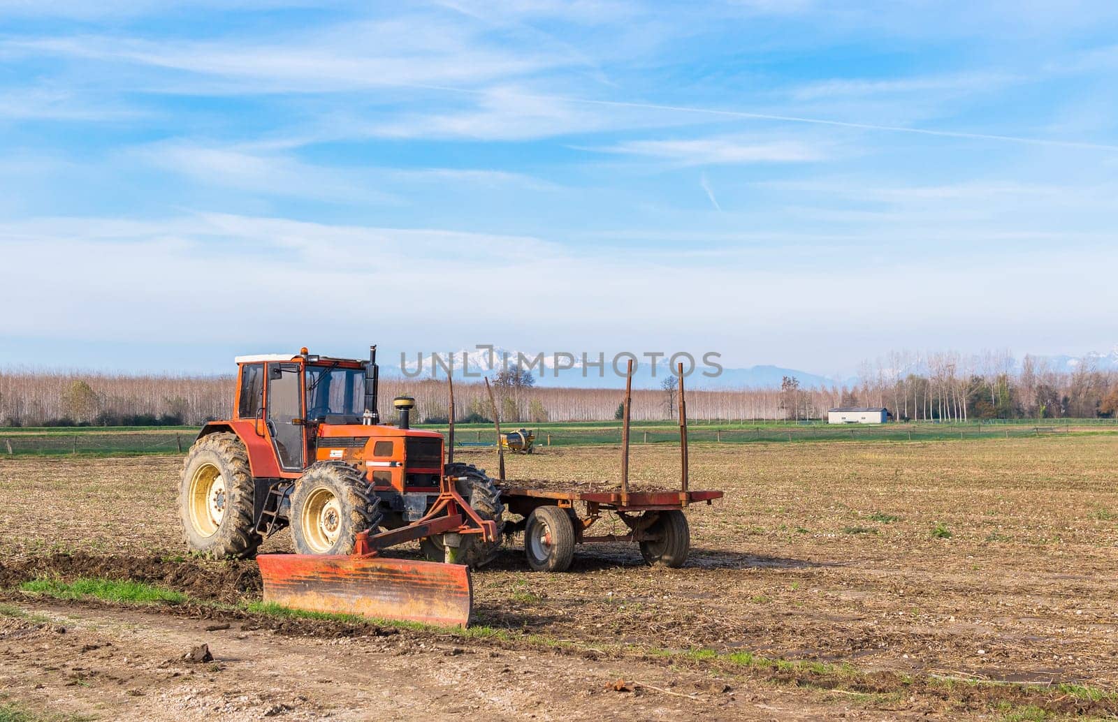 Agricultural Landscape with tractor and agricultural tools