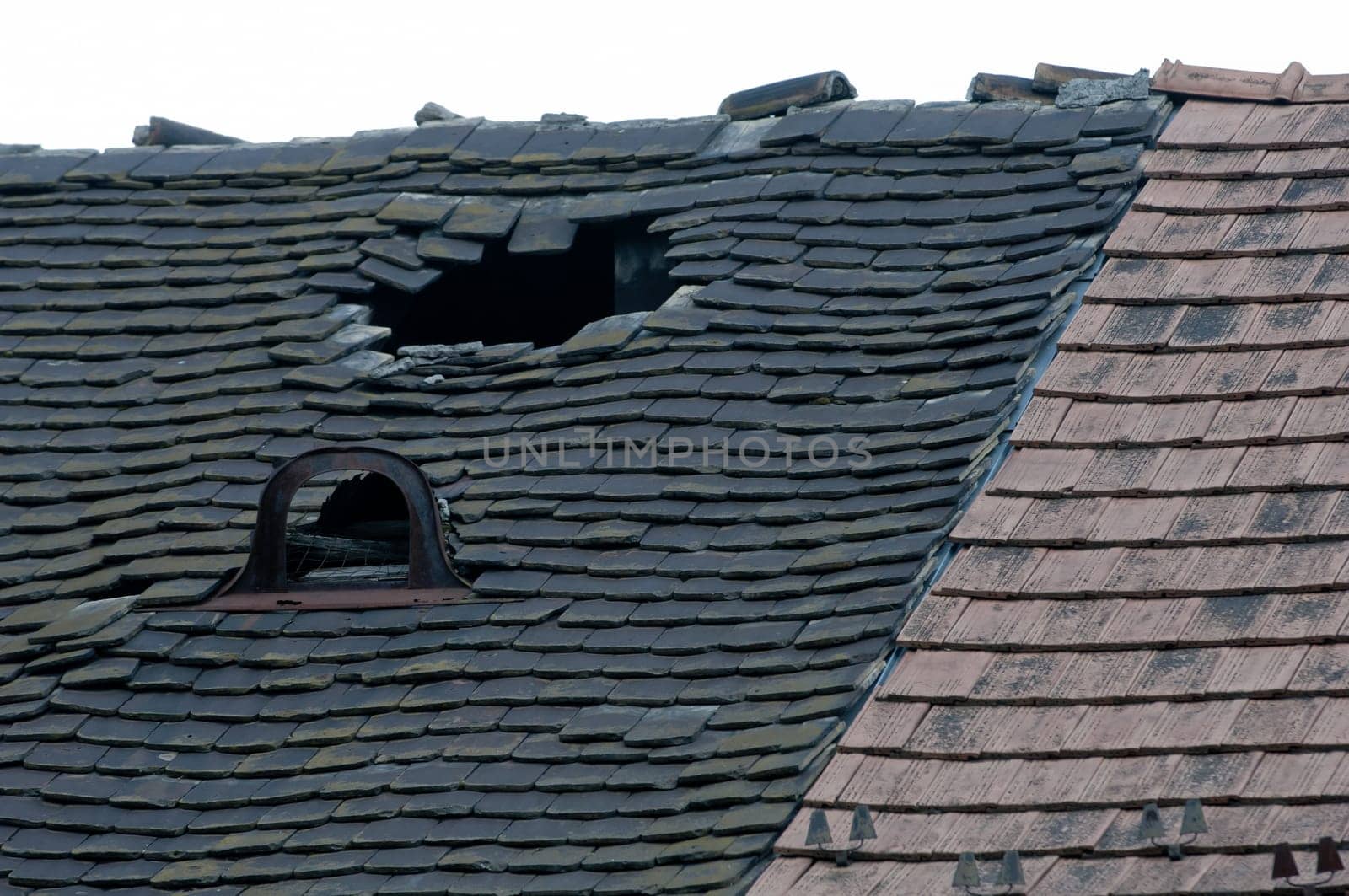 Damaged old tiled roof broken leaked