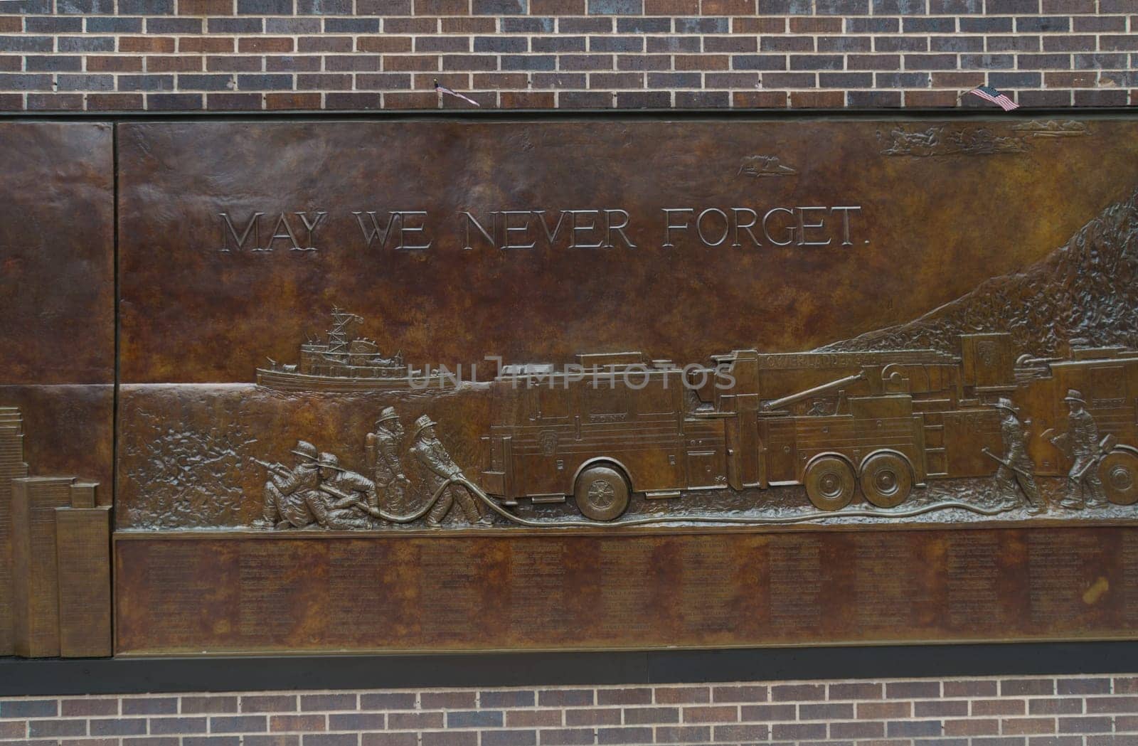 NEW YORK - MAY 2, 2016: Memorial wall close to ground zero. It's dedicated to the 343 members of the NYFD who died on 9/11.