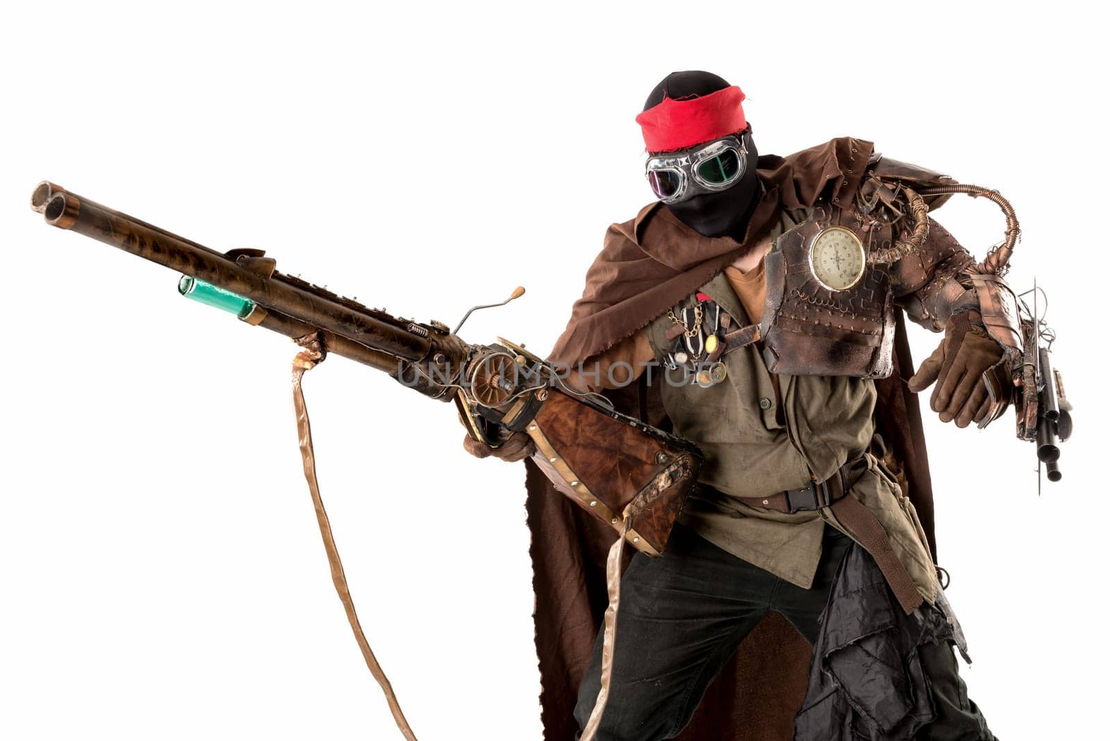 Futuristic soldier posing with gun and armor isolated in white