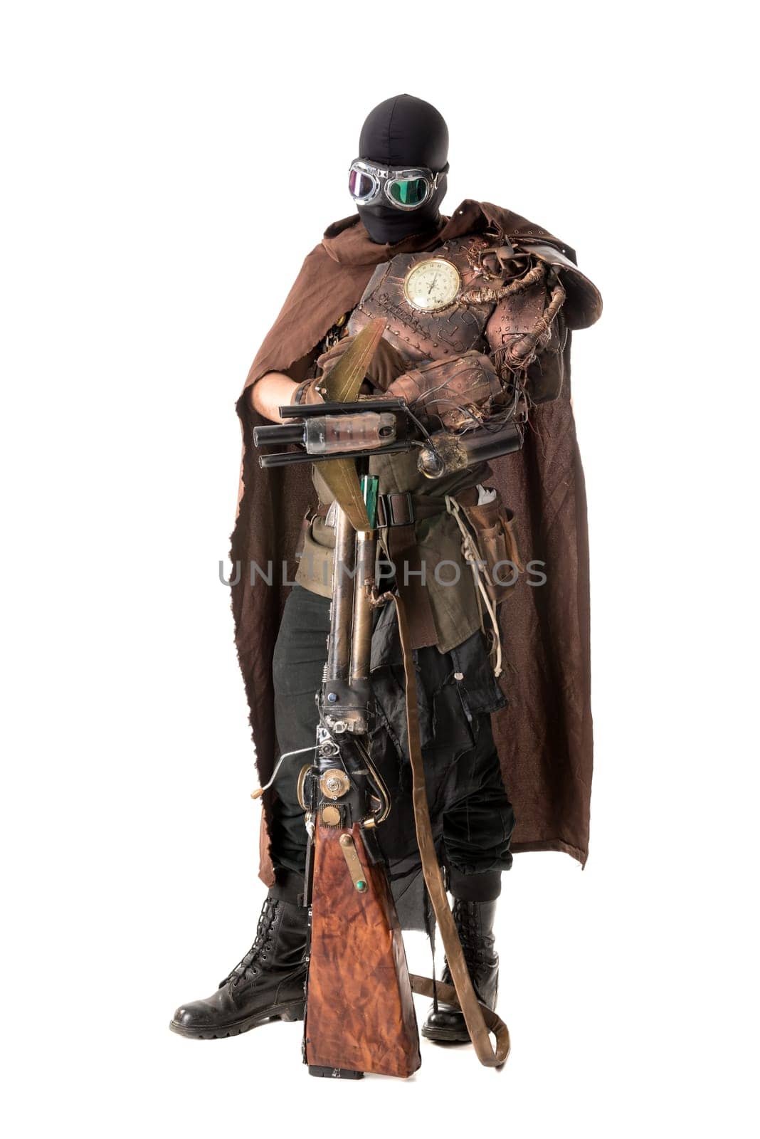 Futuristic soldier posing with gun and armor isolated in white