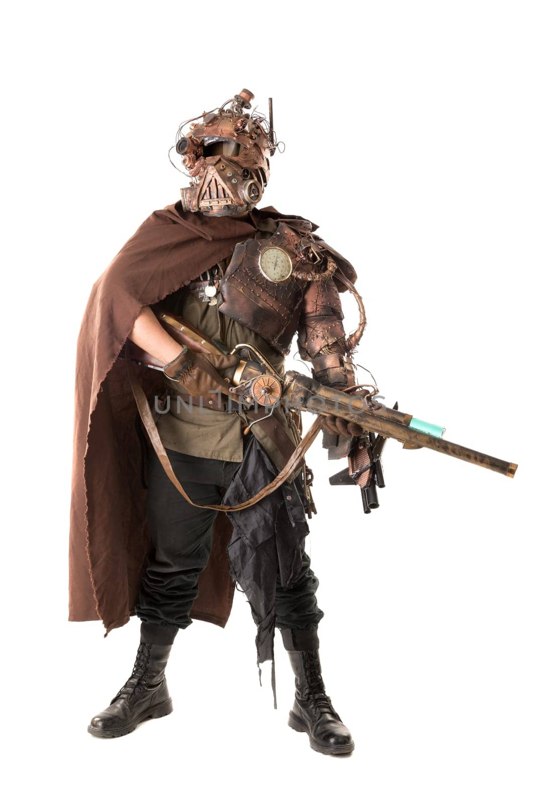 Futuristic soldier posing with gun and armor isolated in white