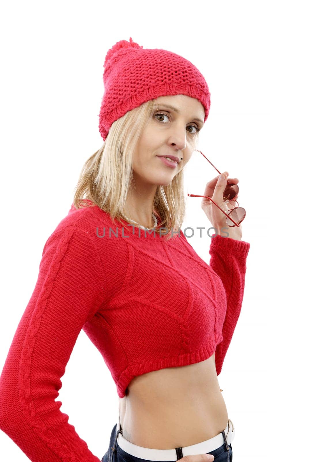 fashion blonde woman with red short sweater and winter hat