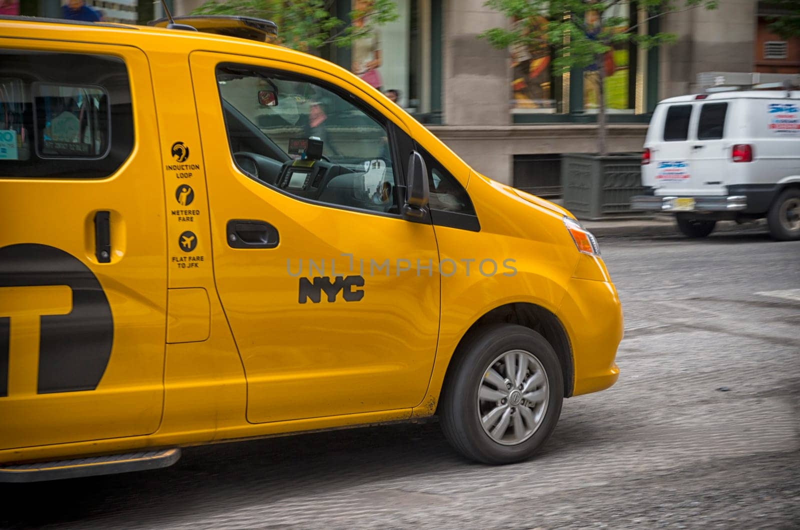 NEW YORK - MAY 2, 2016: Typical yellow cab speeding through the streets of Manhattan