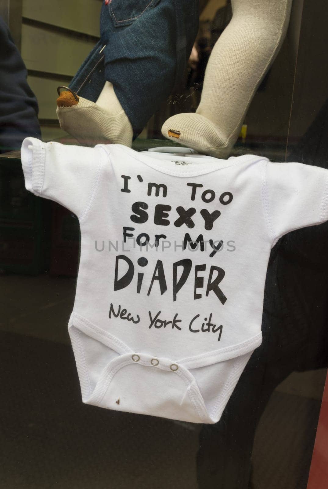 NEW YORK - MAY 2, 2016: Funny baby body suit with text in a souvenir shop in Manhattan