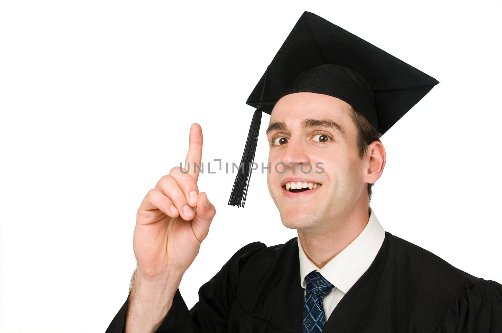 Lateral head-and-shoulder view of a young man in black robe and graduate cap against a white background joyfully knowing raising his index finger.