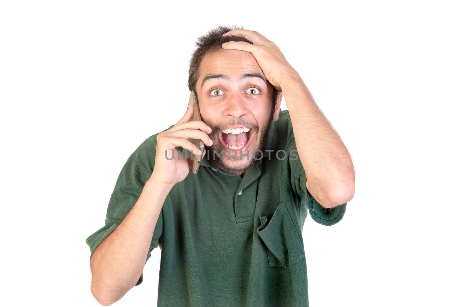 young man with cellphone doing funny faces isolated in white