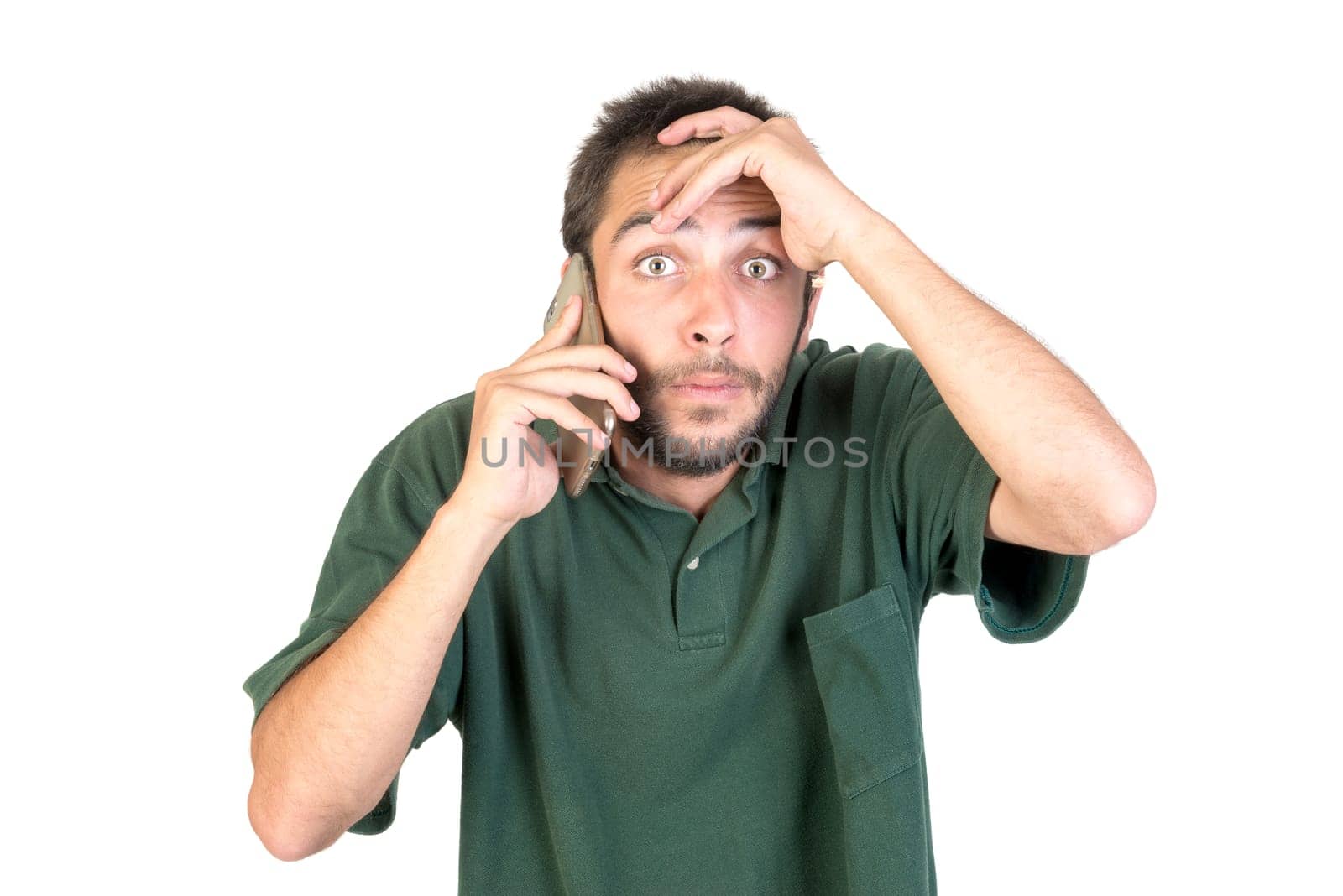 young man with cellphone doing funny faces isolated in white