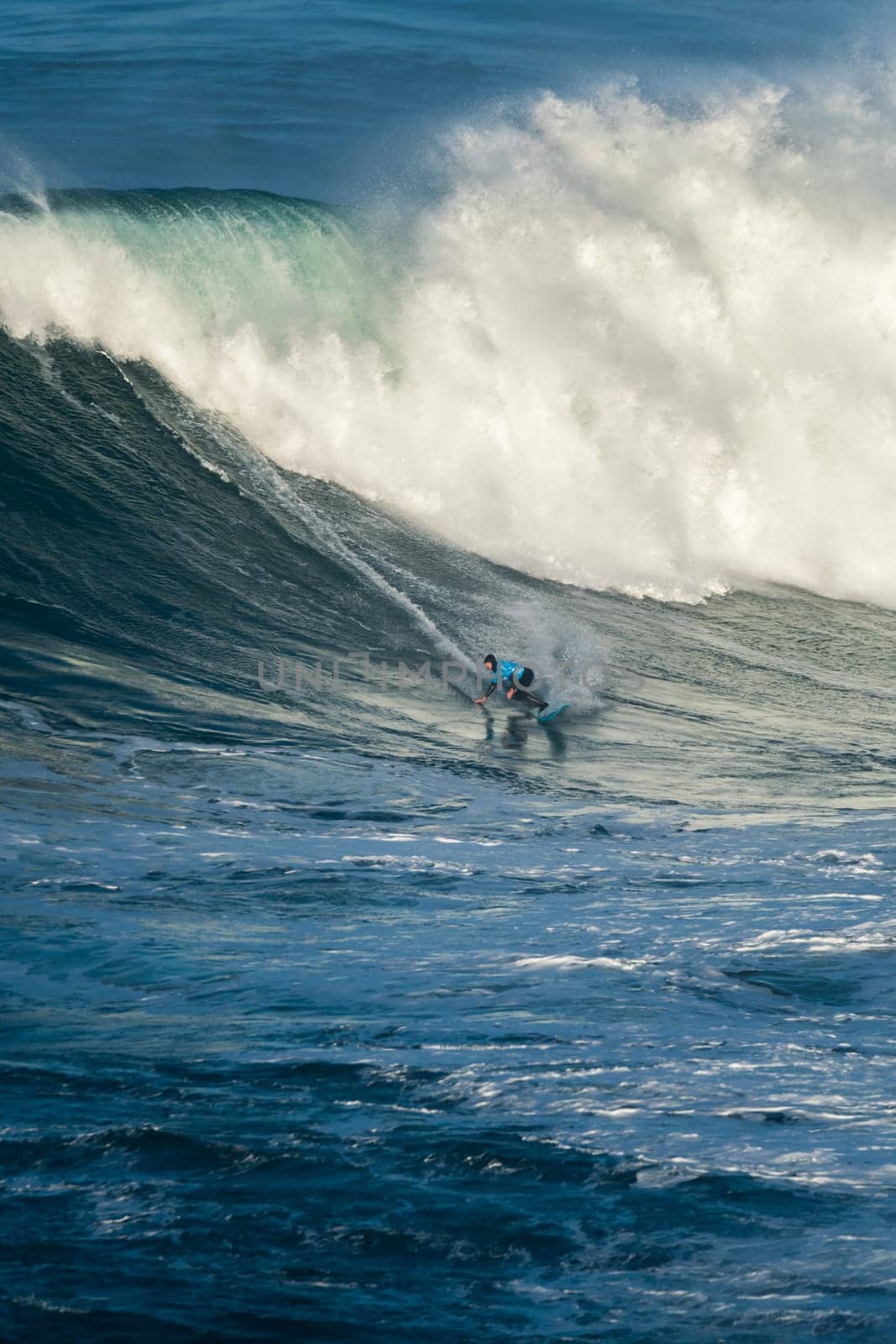NAZARE, PORTUGAL - DECEMBER 20, 2016: Grant Baker (ZAF) during the Nazare Challenge 2016 - Big Wave Tour #3 at Praia do Norte - Nazare, Portugal.