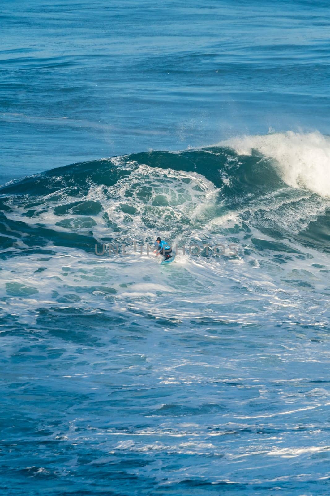 NAZARE, PORTUGAL - DECEMBER 20, 2016: Grant Baker (ZAF) during the Nazare Challenge 2016 - Big Wave Tour #3 at Praia do Norte - Nazare, Portugal.