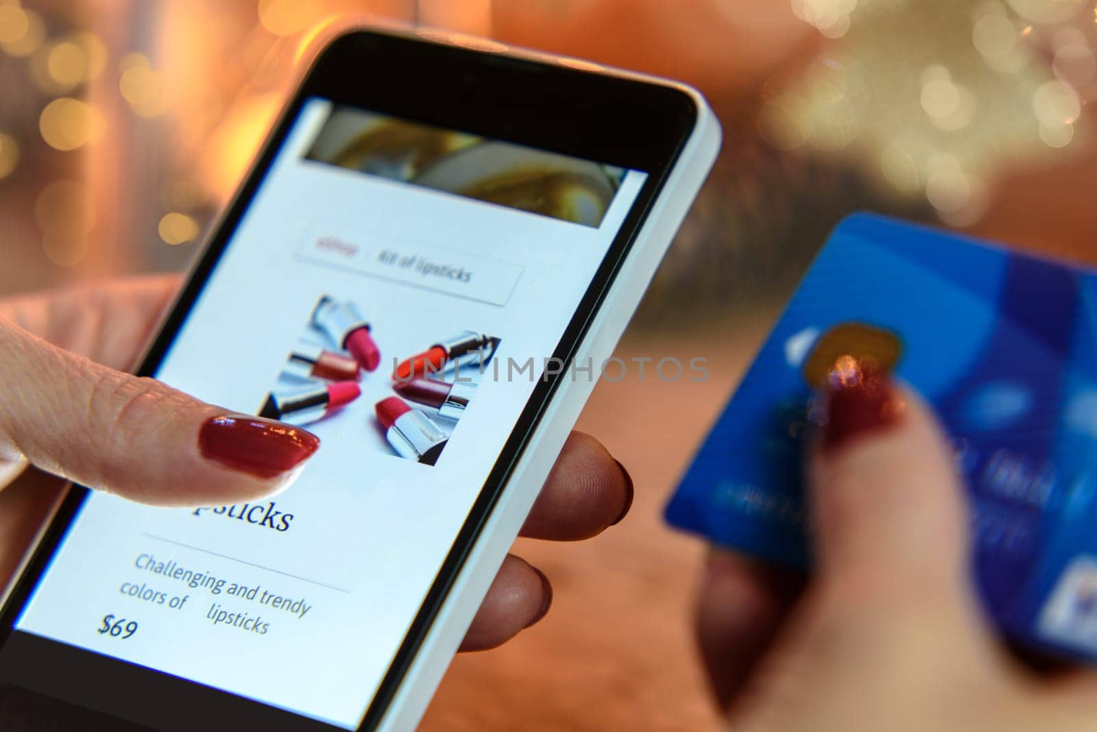 Modern Woman makes shopping via smartphone and a credit card in the e-store