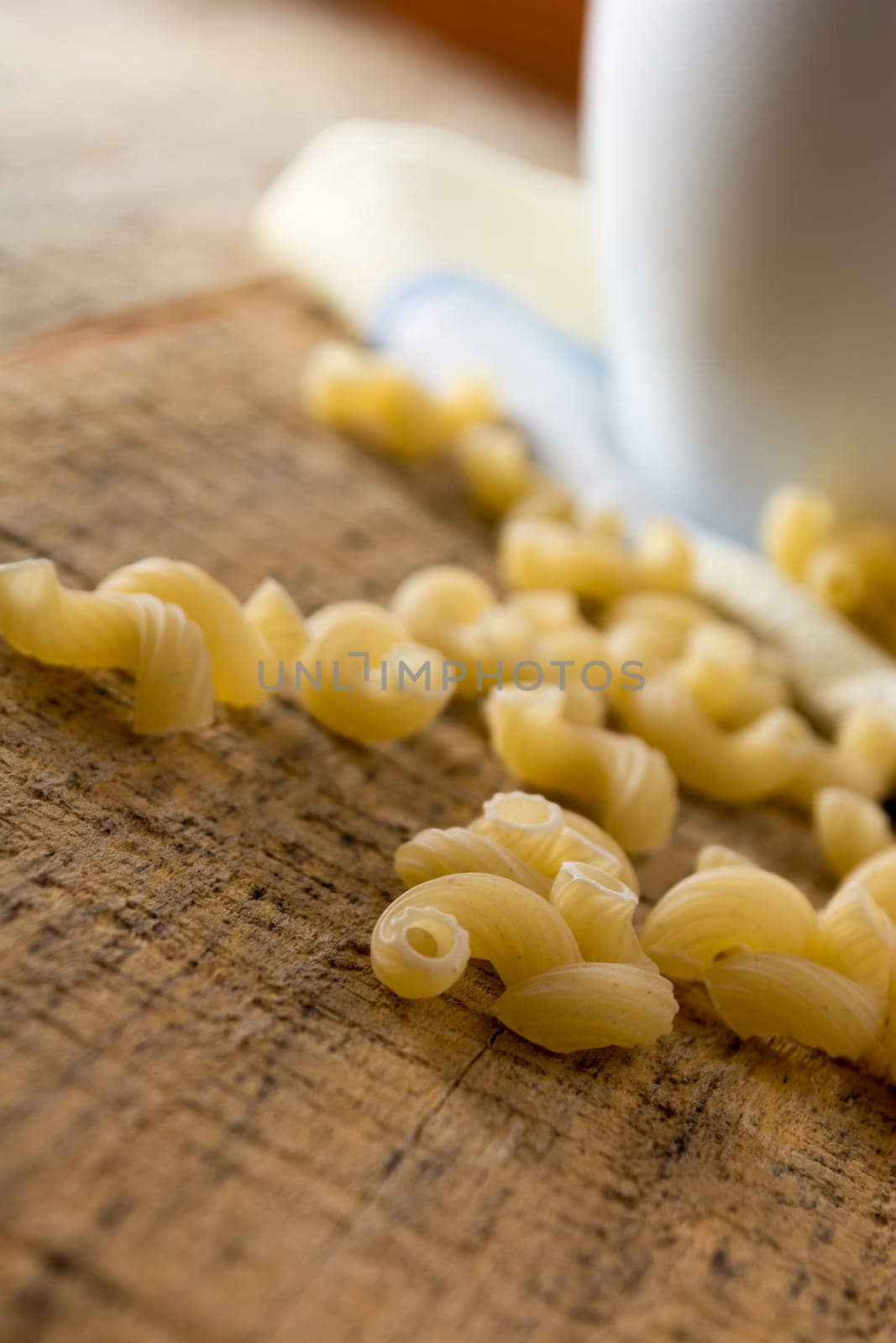 Close up of a salad with pasta, yellow corn and Italian seasonings.
