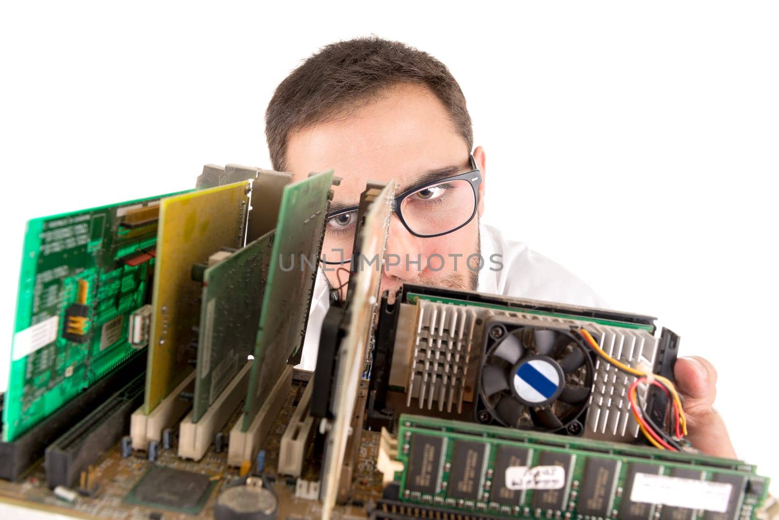 Nerd engineer posing with computer components isolated in a white background