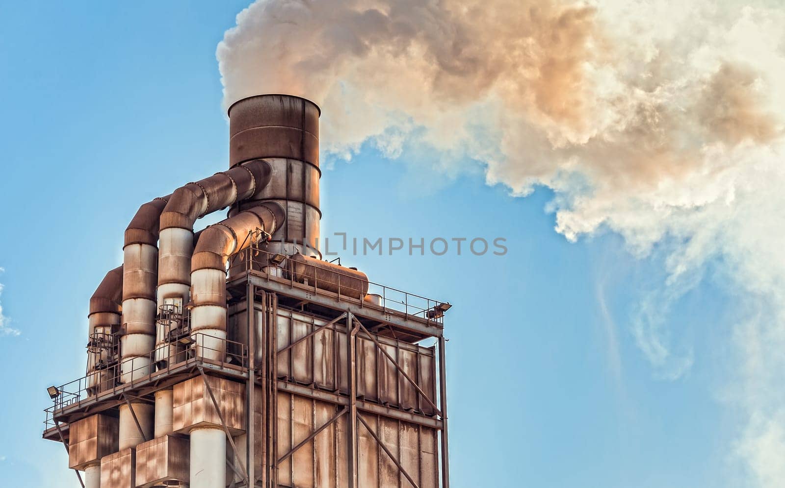 Pollution. Smoke from industrial chimney. Old smokestack of factory.