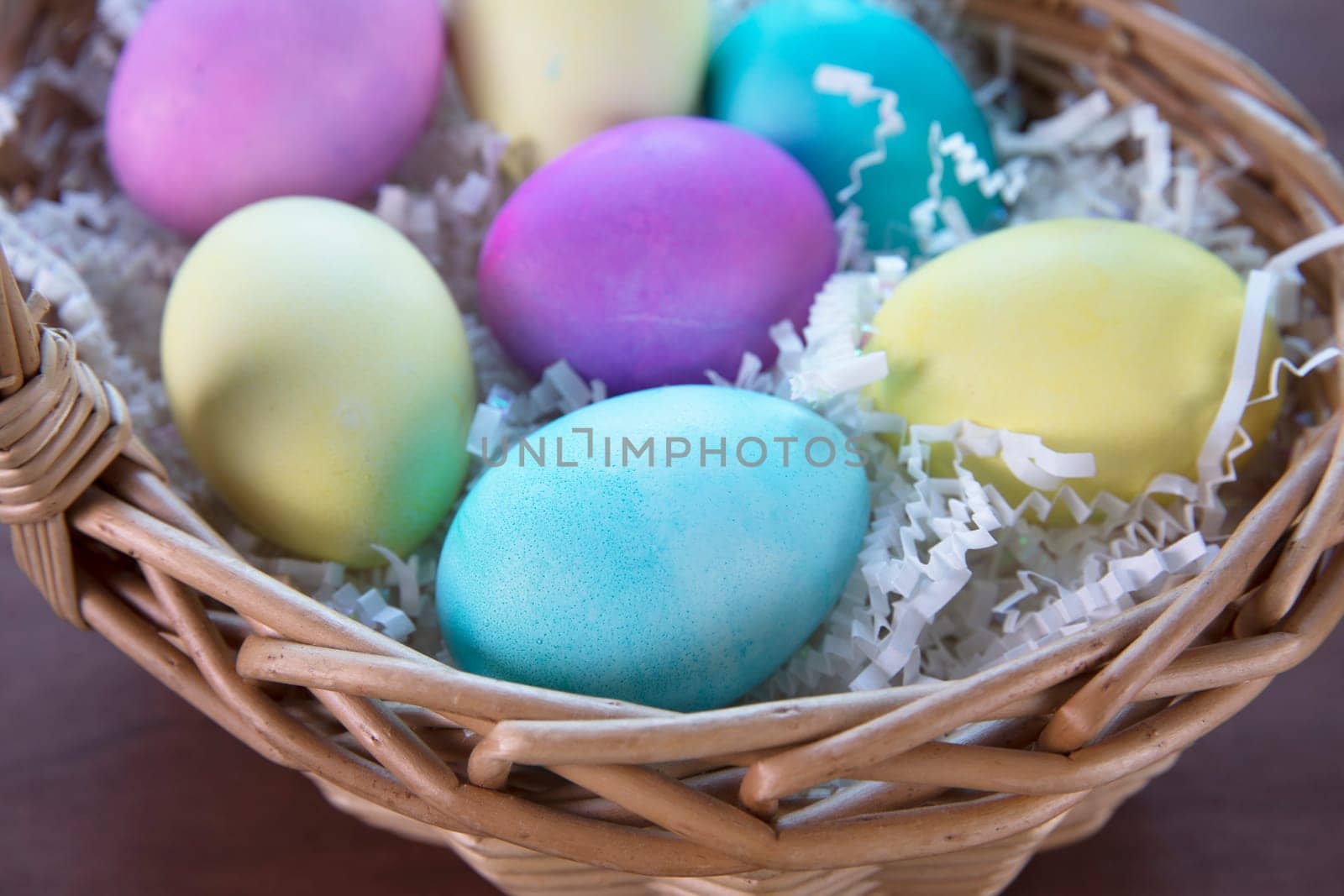 Colorful Easter eggs in Easter basket.