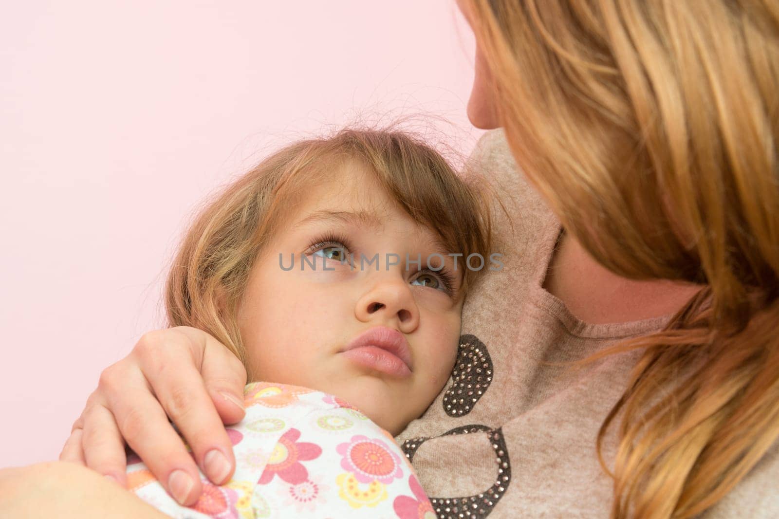 Mom comforting five-year daughter