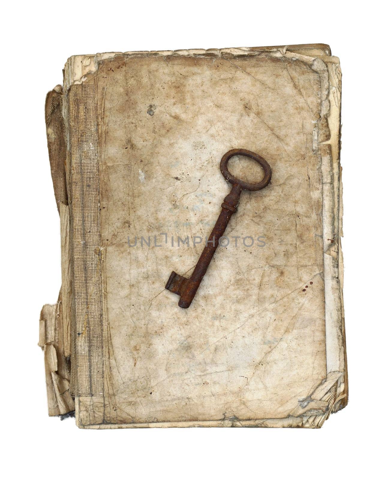 Worn and tattered book and old rusty key on a white background