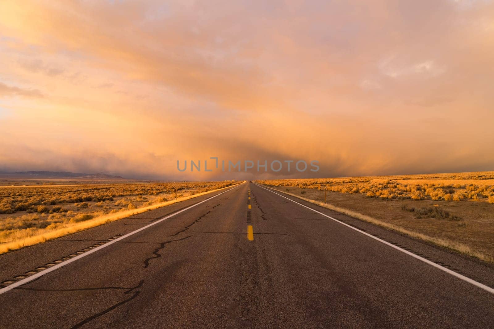 A side road off the interstate stormy skies at sunset