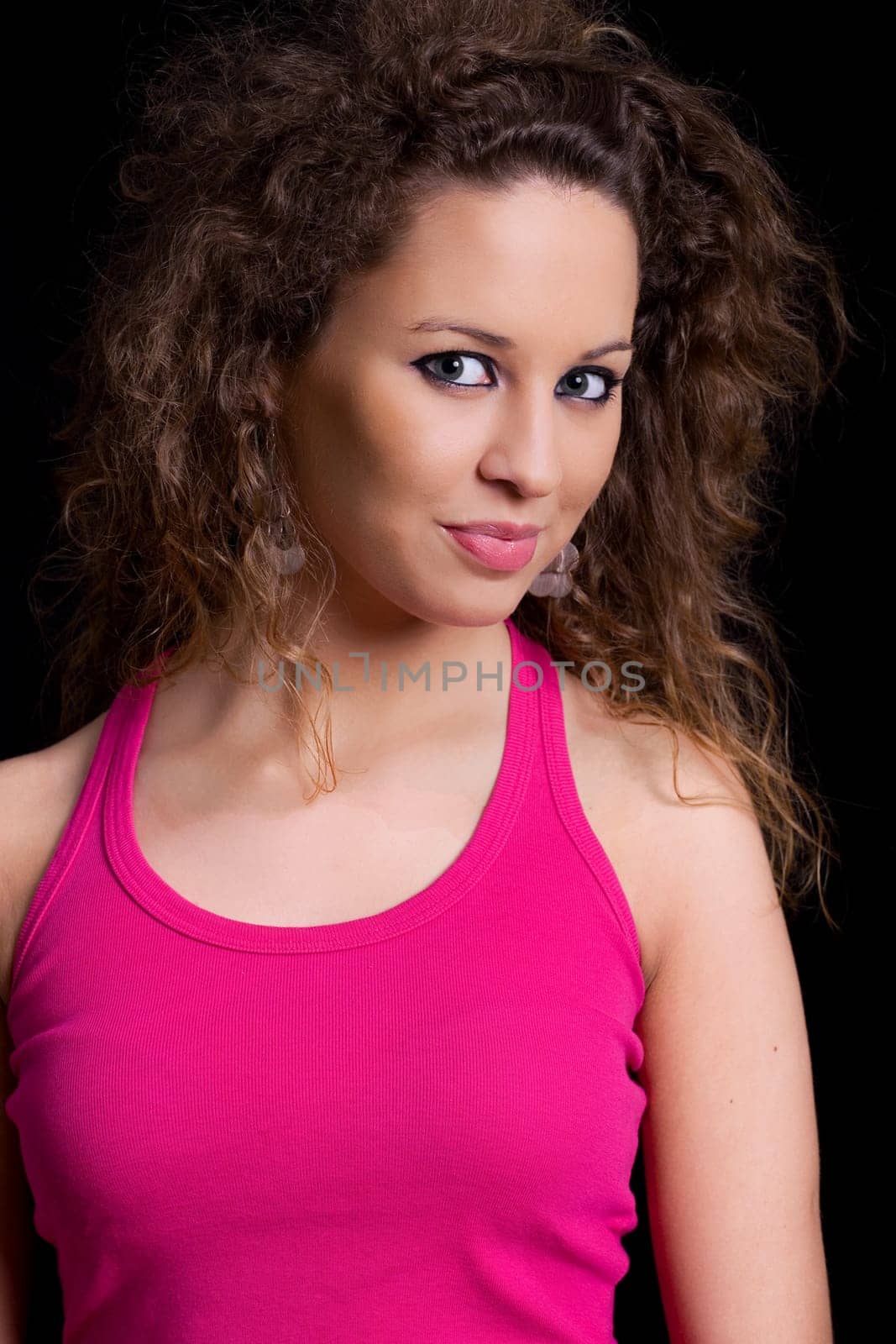 young beautiful brunette portrait against black background
