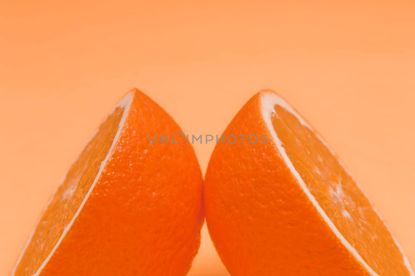 Orange pattern on orange colored background citrus arrangement