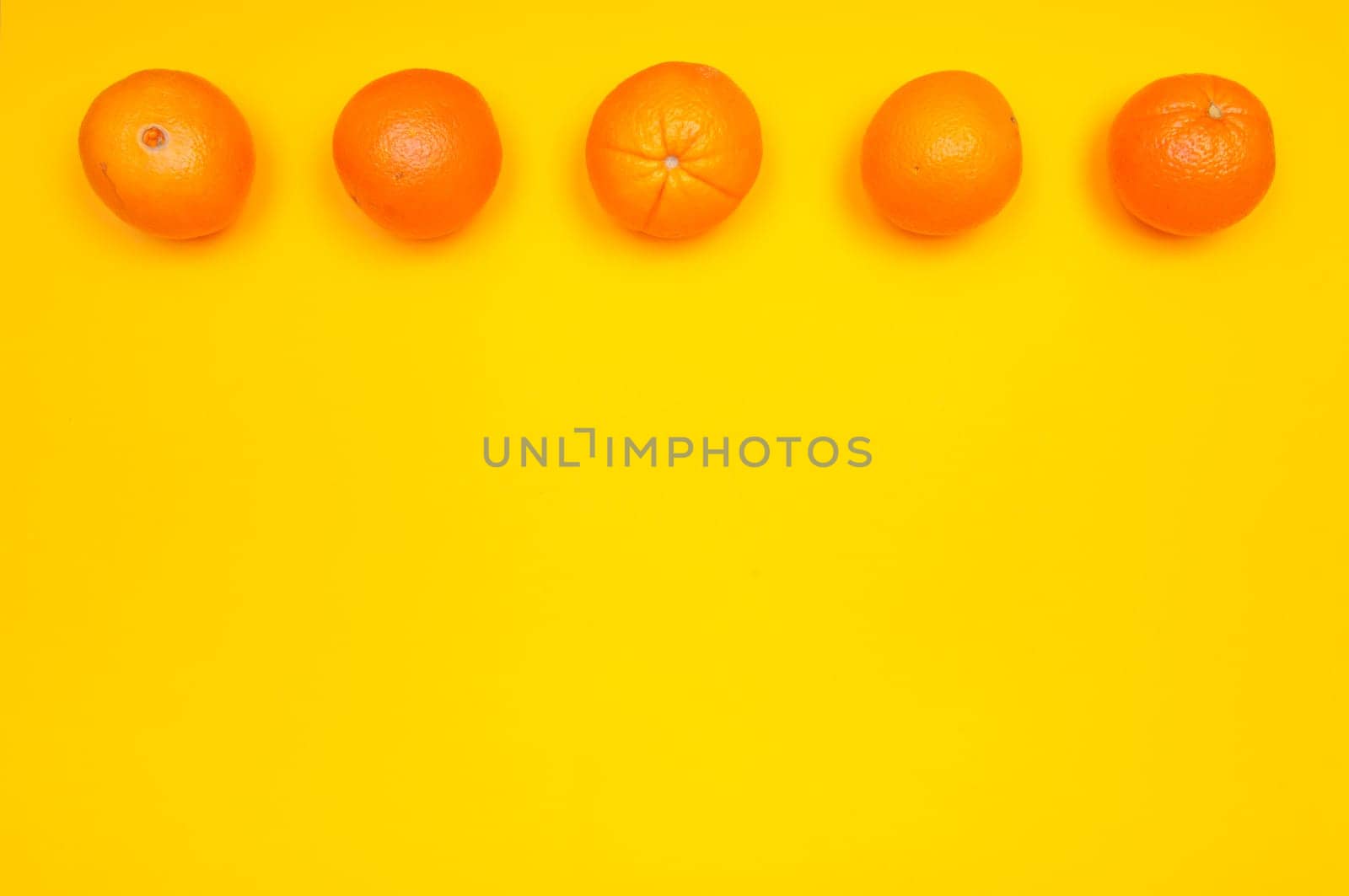 Orange pattern on orange colored background citrus arrangement