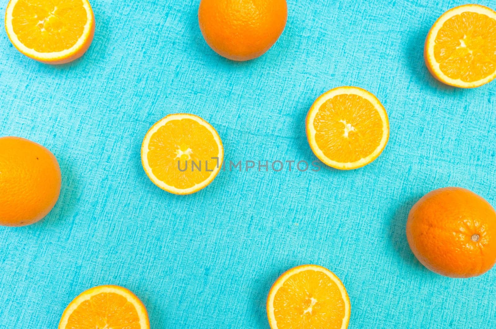 Orange and lemon citrus fruit pattern on light blue background