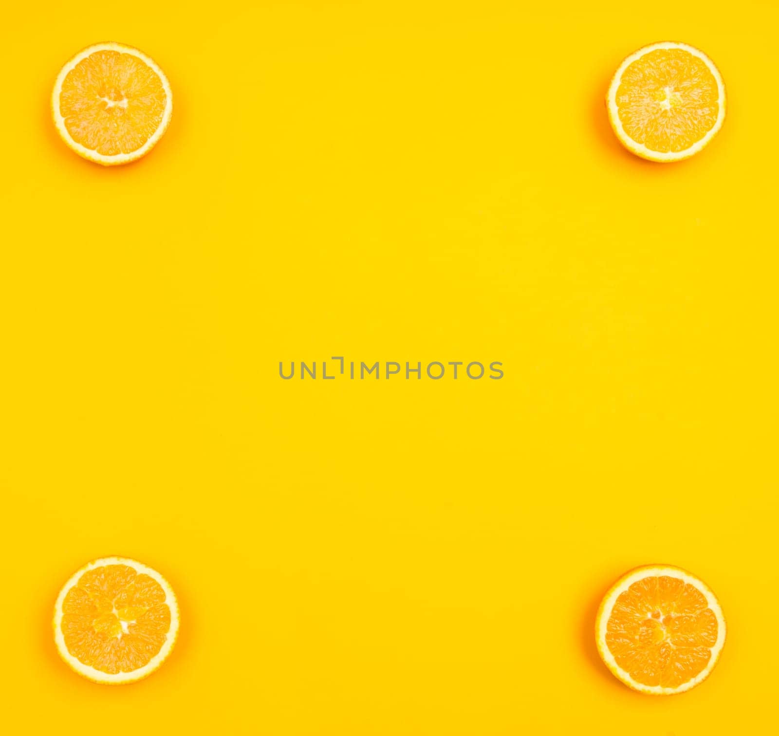Orange pattern on orange colored background citrus arrangement