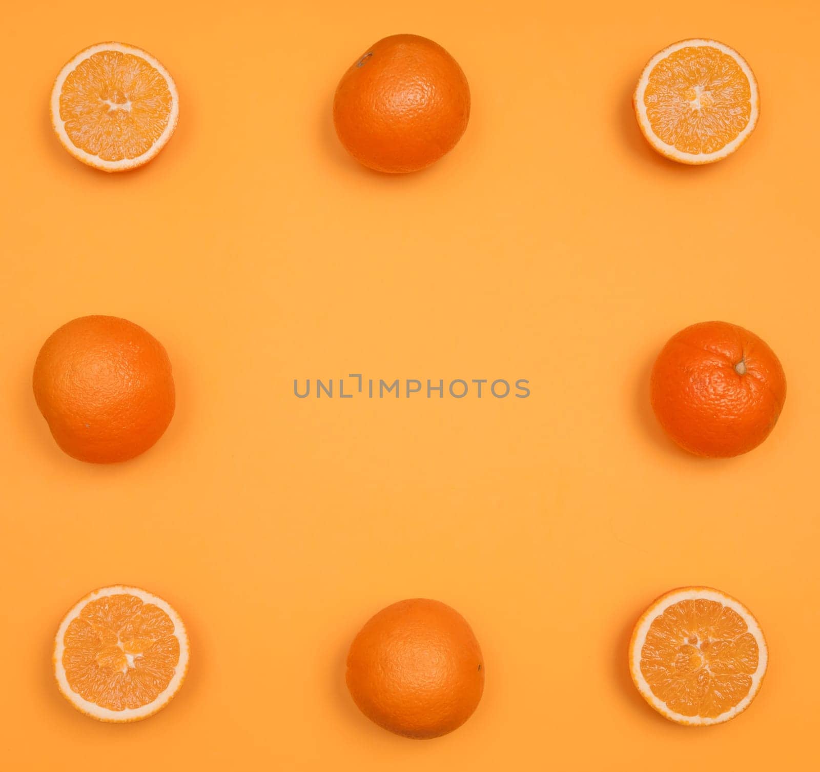 Orange pattern on orange colored background citrus arrangement