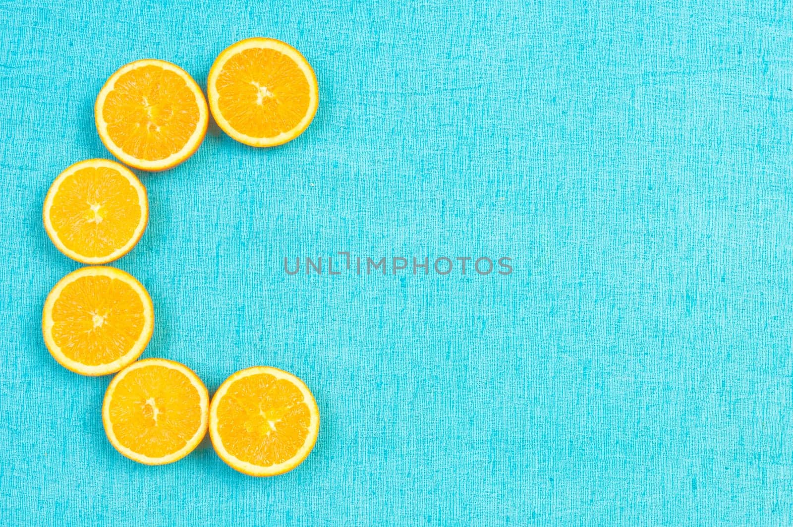 Orange and lemon citrus fruit pattern on light blue background
