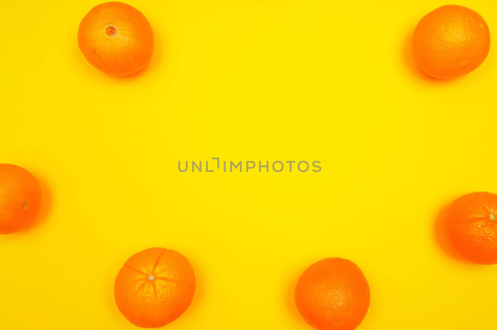 Orange pattern on orange colored background citrus arrangement