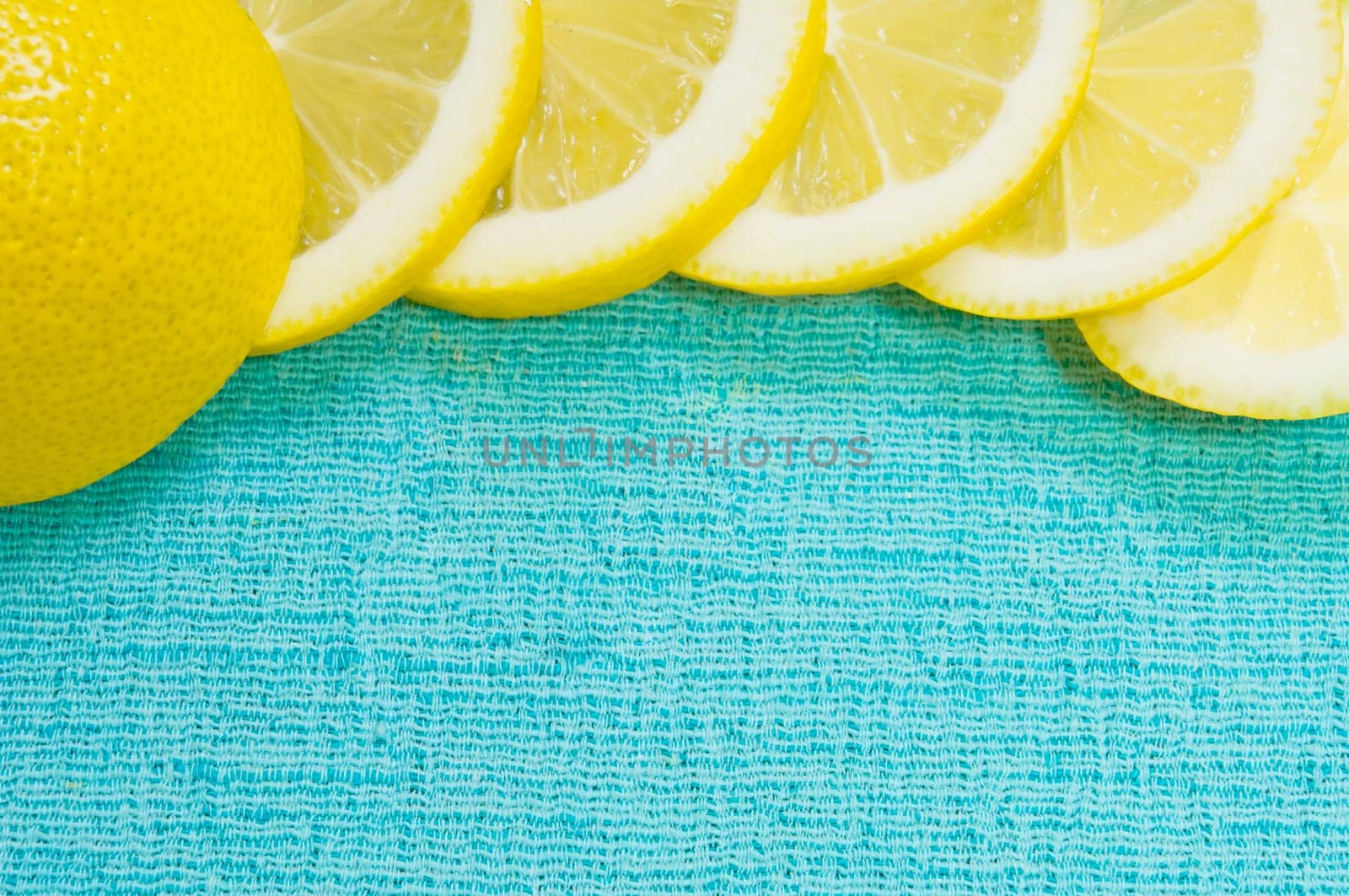Orange and lemon citrus fruit pattern on light blue background