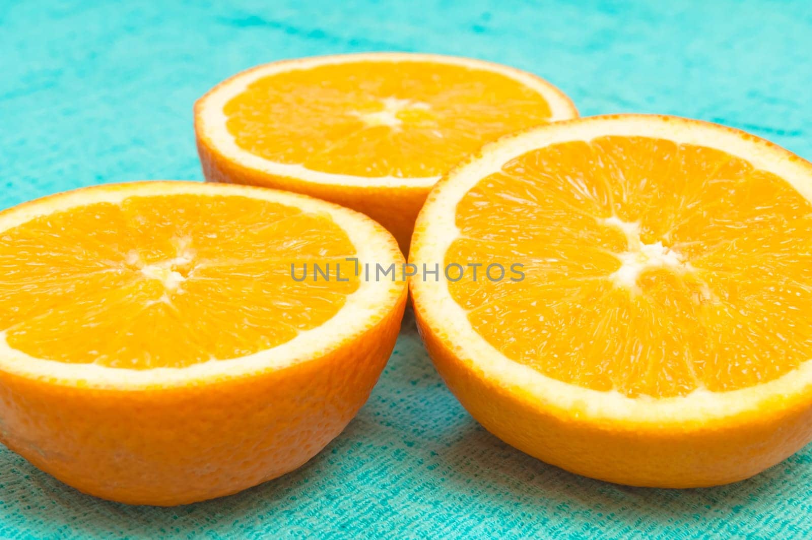 Orange and lemon citrus fruit pattern on light blue background